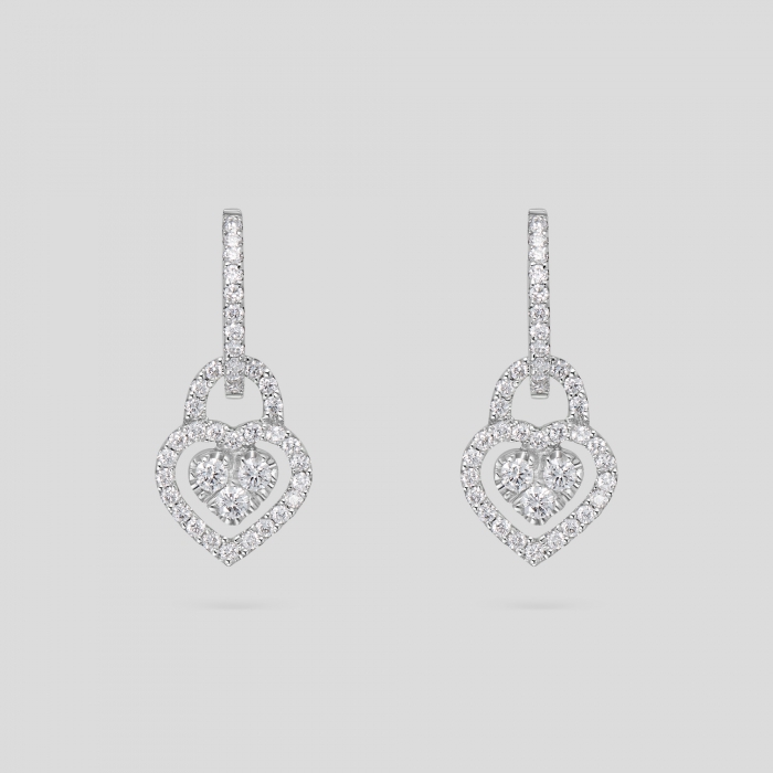 Foto Orecchini in oro bianco e diamanti con pendente a cuore